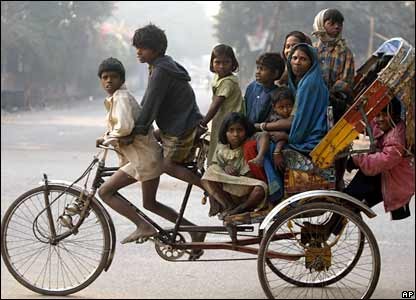 Overpopulation in India 10 people on a tricycle