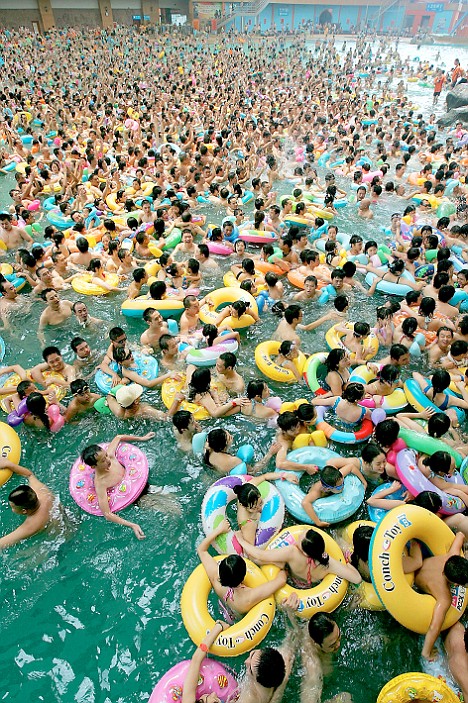 thousands of swimmers crowded into a pool in penglai in sichuan western china